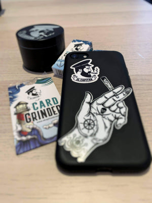 el capitan sticker on mobile phone cover next to card grinder